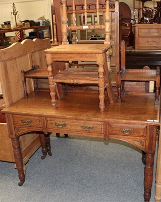 Lot 1220 - An early 20th century oak two-piece bedroom suite comprising a mirror back dressing table and a...