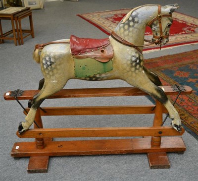 Lot 1223 - A late 19th century/early 20th century painted wooden rocking horse bearing Ayres, London...