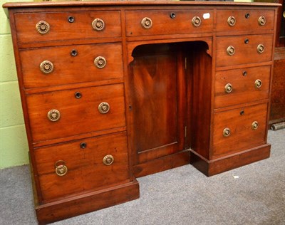 Lot 1244 - A Edwardian walnut kneehole desk, with green leather writing surface, 77cm high, 114cm wide,...