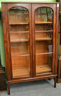 Lot 1255 - A early 20th century mahogany glazed display case, raise on square tapering leg