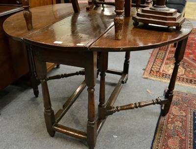 Lot 1274 - An 18th century and later oak gateleg table