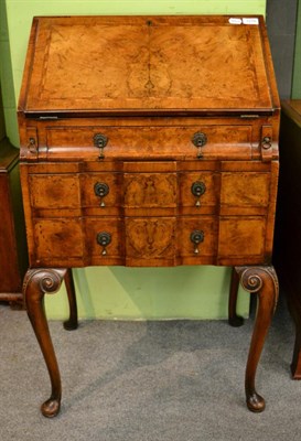 Lot 1276 - Figured walnut cross banded bureau, fall front, the interior fitted with small drawers, pigeon...