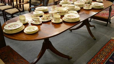 Lot 1294 - A 20th century mahogany twin pedestal D end dining table, with one additional leaf