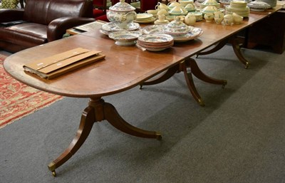 Lot 1296 - A early 20th century, three pillar mahogany D end dining table, with two additional leaves,...