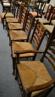 Lot 1303 - Harlequin set of five ash and rush seated ladder back chairs, including one carver