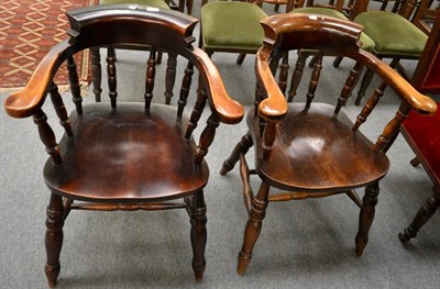 Lot 1305 - A pair of 20th century smokers bow armchairs