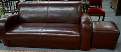 Lot 1306 - A modern leather sofa and stool