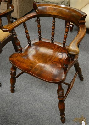 Lot 1313 - An elm captain's chair