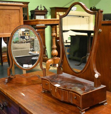 Lot 1331 - A 19th century mahogany shield form dressing mirror, and a mahogany framed oval dressing mirror...