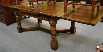 Lot 1332 - Reproduction oak extending dining table, 274cm extended