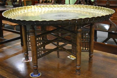 Lot 1333 - A large brass top table