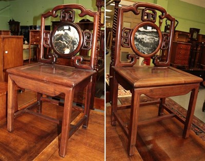 Lot 1334 - Pair of Chinese hardwood chairs, with circular marble panel backs