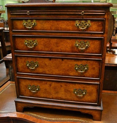 Lot 1335 - Reproduction figured walnut and oak lined bachelor's chest with brushing slide, 60cm wide