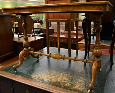 Lot 1337 - A 19th century leather inset writing table