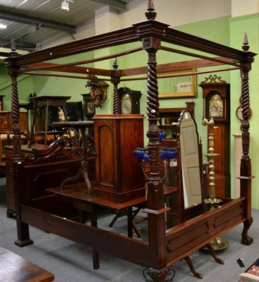 Lot 1344 - A reproduction carved hardwood four poster bed