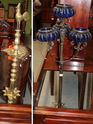 Lot 1347 - A 20th century brass and engraved free standing lamp/torchere, and a modern three branch decorative