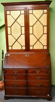 Lot 1362 - A George III style mahogany secretaire bookcase