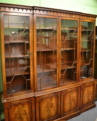 Lot 1364 - A large reproduction mahogany bookcase/display cabinet, 2155cm by 204cm by 40cm deep