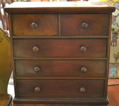 Lot 1372 - A 19th century mahogany miniature four height chest of drawers