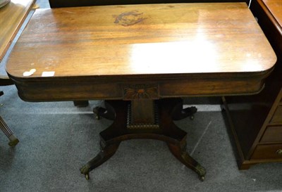 Lot 1375 - A Regency rosewood fold over tea table, early 19th century, with gadrooned border centred by a...