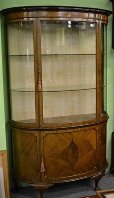 Lot 1383 - A 1920's/30's glazed mahogany bow fronted display cabinet