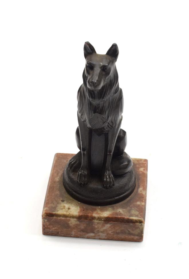 Lot 3007 - A 1920's Bronze Cast Dog Mascot, signed Ruffony, modelled as a seated Alsatian, on a circular base