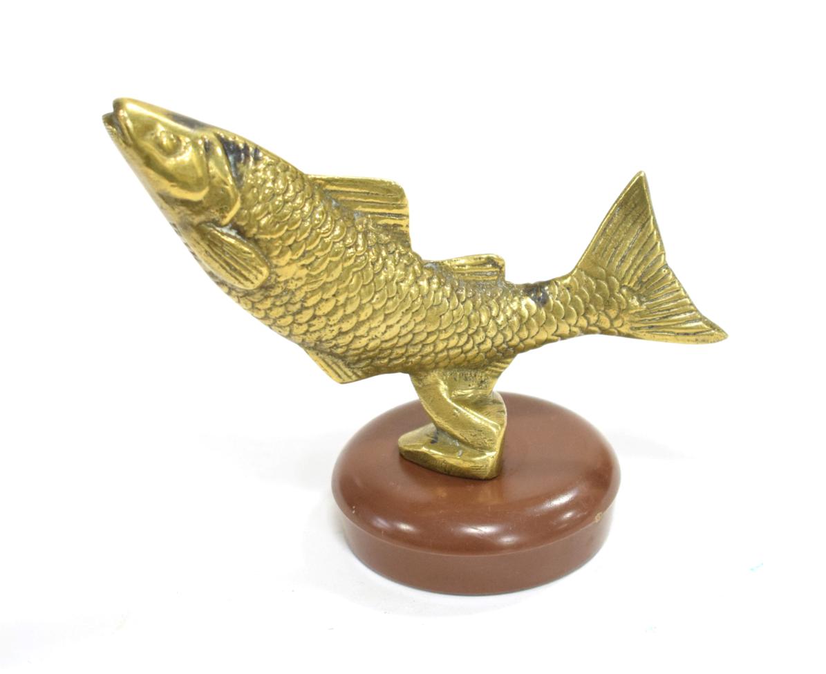 Lot 3016 - A 1930's Brass Car Accessory Mascot, in the form of a leaping salmon, mounted on a later brown...
