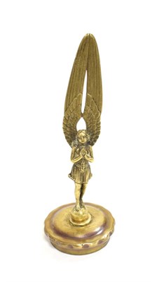 Lot 3021 - An AE Lejeune Brass Commemorative Accessory Mascot, in the form of the winged Angel of Peace,...