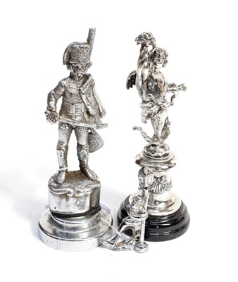 Lot 3033 - A Chrome on Brass Car Mascot, in the form of a Hussar standing on a rocky base, mounted on a...