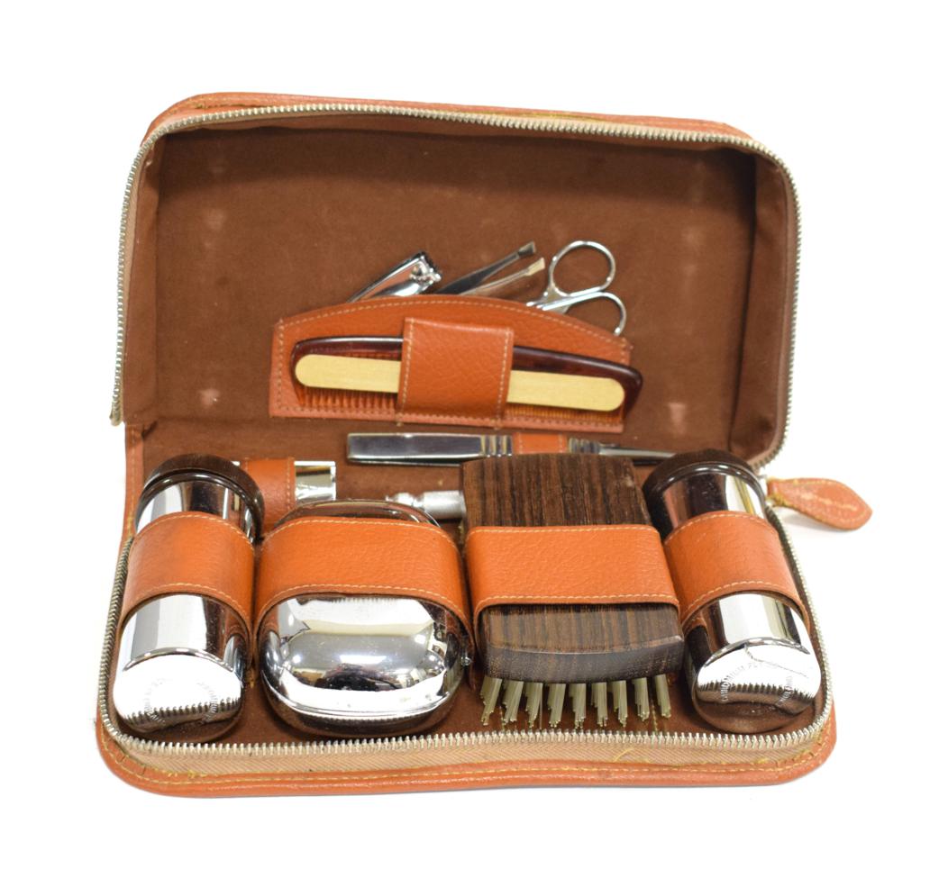 Lot 3103 - Bentley Interest: A 1940/50 Brown Leather Cased Gentleman's Grooming Set, fitted with chromed...