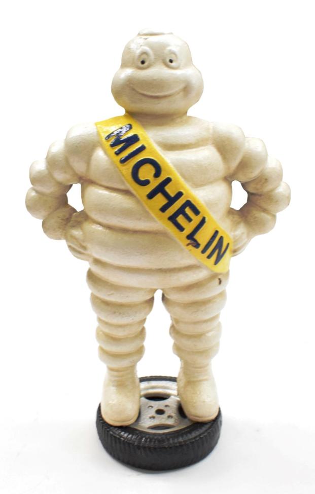 Lot 3112 - A Michelin Cast Metal Advertising Figure, with yellow sash, the front stamped Michelin, the...