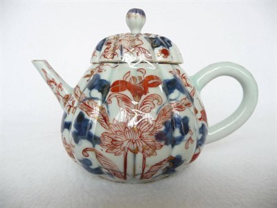 Lot 114 - A Chinese Imari Porcelain Teapot and Cover, circa 1730, of fluted pear shape with ball knop painted