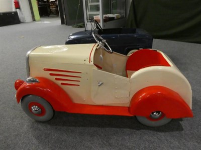 Lot 3221 - A 1930's Child's Pedal Car, repainted cream and red, with chromed three-spoke steering wheel,...