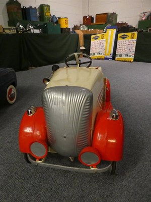 Lot 3221 - A 1930's Child's Pedal Car, repainted cream and red, with chromed three-spoke steering wheel,...