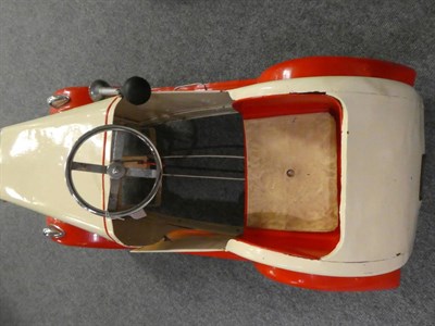 Lot 3221 - A 1930's Child's Pedal Car, repainted cream and red, with chromed three-spoke steering wheel,...