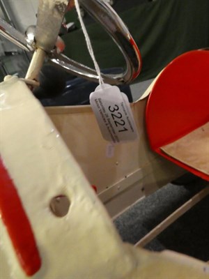 Lot 3221 - A 1930's Child's Pedal Car, repainted cream and red, with chromed three-spoke steering wheel,...