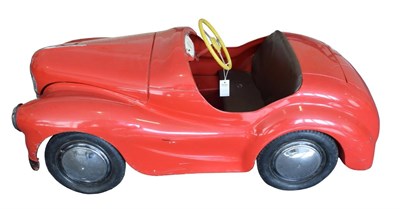 Lot 3224 - A 1940's Metal Bodied Child's Pedal Car, painted red, with metal three-spoke steering wheel,...