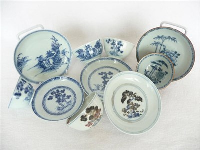 Lot 122 - A Nanking Porcelain Tea Bowl and Saucer, 18th century, painted in underglaze blue with vine...