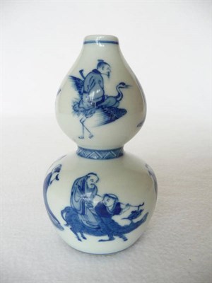 Lot 125 - A Chinese Porcelain Double Gourd Vase, 19th century, painted in underglaze blue with various...