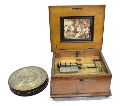 Lot 65 - Table Top Polyphon playing 11'' discs, with single piece comb in wooden case with floral...