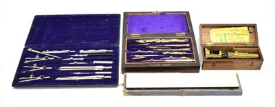 Lot 86 - Brass Travelling Microscope with a few prepared slides (cased) together with two drawing sets and a