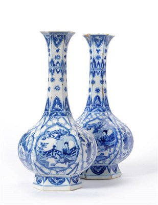 Lot 132 - A Pair of Chinese Porcelain Hexagonal Bottle Vases, Kangxi (1662-1722), with tall flared necks...