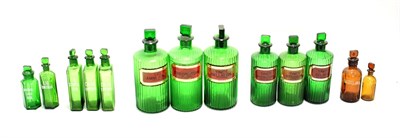 Lot 112 - Apothecary Jars And Bottles six green glass examples with gold/red bordered labels including...