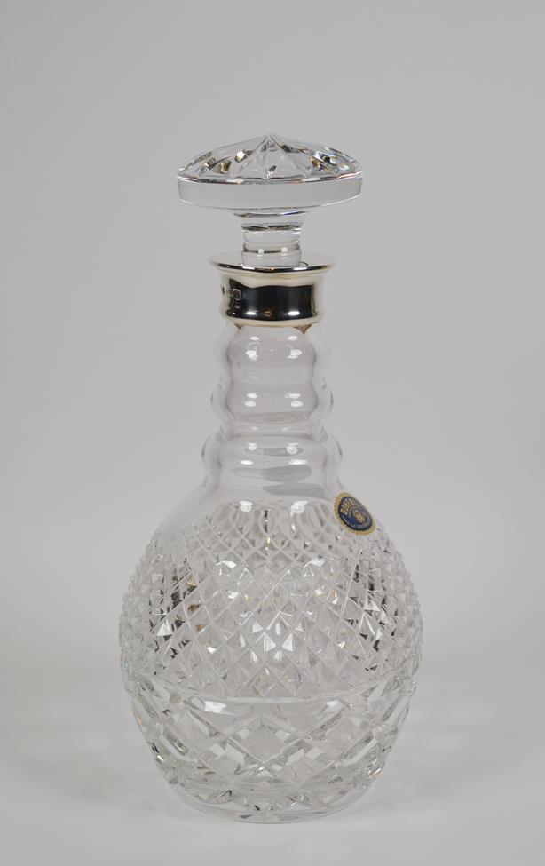 Lot 4 - An Elizabeth II silver-mounted Bohemian cut-glass decanter, the silver-mount by C. J. Vander,...