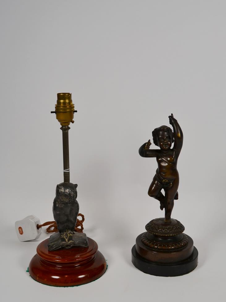 Lot 13 - A bronze cherub and a spelter owl lamp (2)