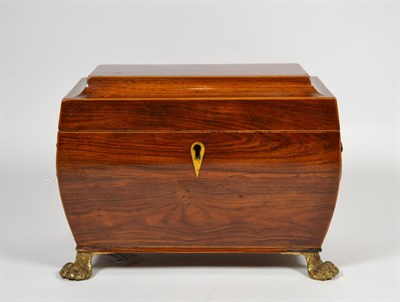 Lot 15 - An Early 19th century rosewood tea caddy, of rounded sarcophagus form, with box strung edges,...