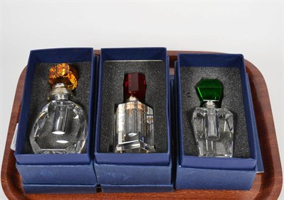 Lot 22 - Three Elizabeth II silver-mounted glass perfume bottles, by Laurence R. Walker and Co., Birmingham