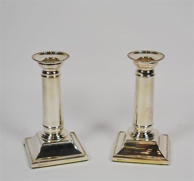 Lot 28 - A pair of Elizabeth II silver candlesticks, by C. J. Vander, Sheffield, 1997, each on square beaded