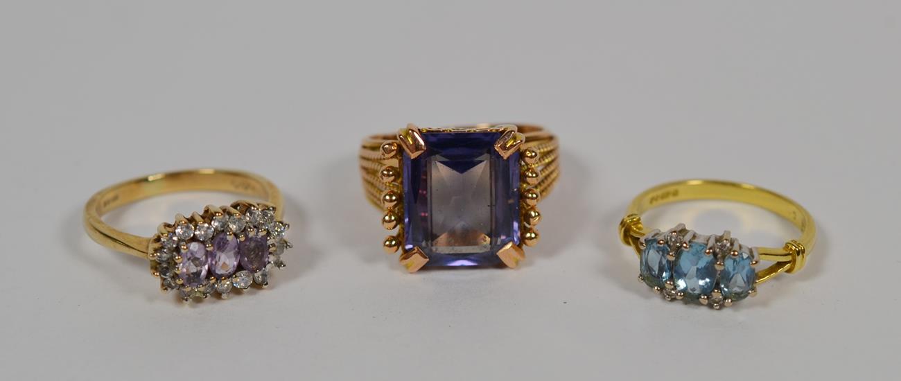 Lot 56 - A synthetic sapphire simulating alexandrite ring, finger size K1/2; a 9 carat gold amethyst cluster