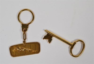 Lot 62 - A 9 carat gold leaping jaguar keyring; and a 9 carat gold key shaped keyring